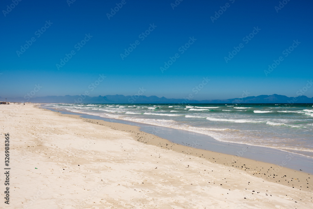 White sand beach in Africa with active ocean swell White sand beach in Africa with active ocean swell