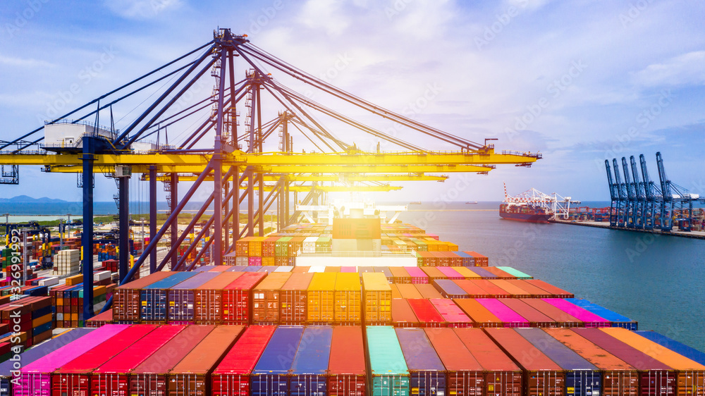 Container ship at industrial port in import export business logistic