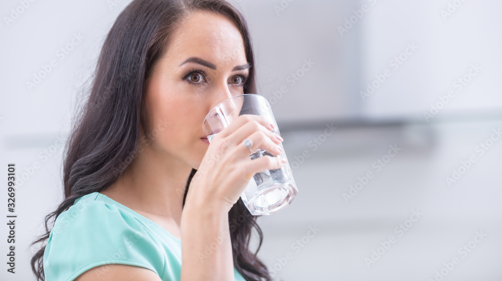 young woman drinks clean water adheres to drinking regime. young woman drinks clean water adheres to drinking regime.