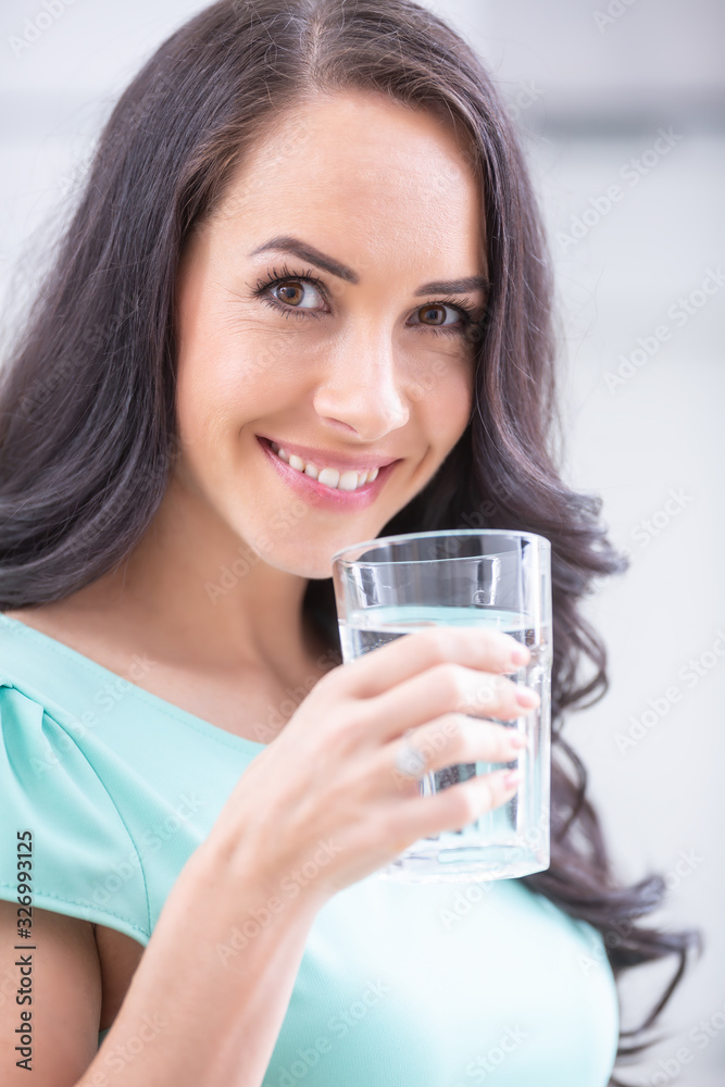 young woman drinks clean water adheres to drinking regime. young woman drinks clean water adheres to drinking regime.