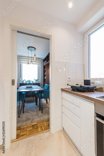 Fototapeta Naklejka Na Ścianę i Meble -  Small kitchen interior with a view to a dining room