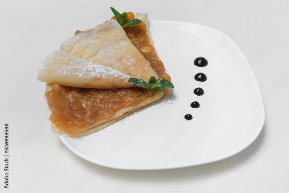 Two Pancakes with apple on white background Two Pancakes with apple on white background