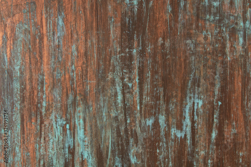 The texture of the copper background is covered with a patina photo