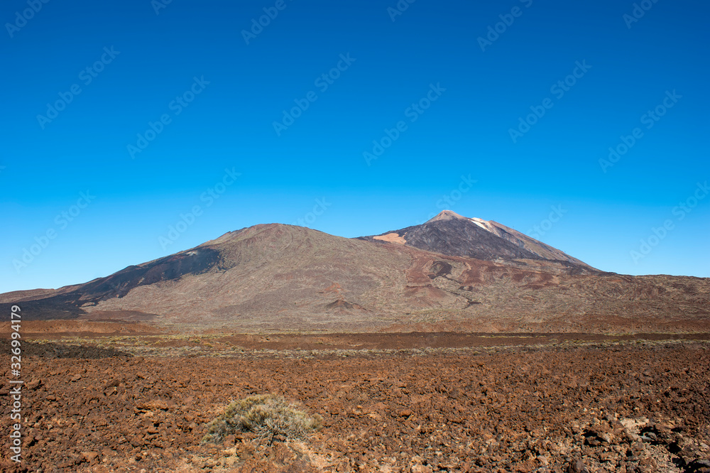 The top of the Teide volcano. The valley of the Teide volcano. In the distance, you can see the frozen lava which was flowing down the slope of Pico Viejo.