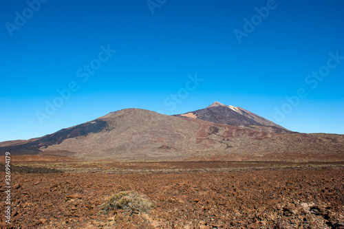 The top of the Teide volcano. The valley of the Teide volcano. In the distance, you can see the frozen lava which was flowing down the slope of Pico Viejo.