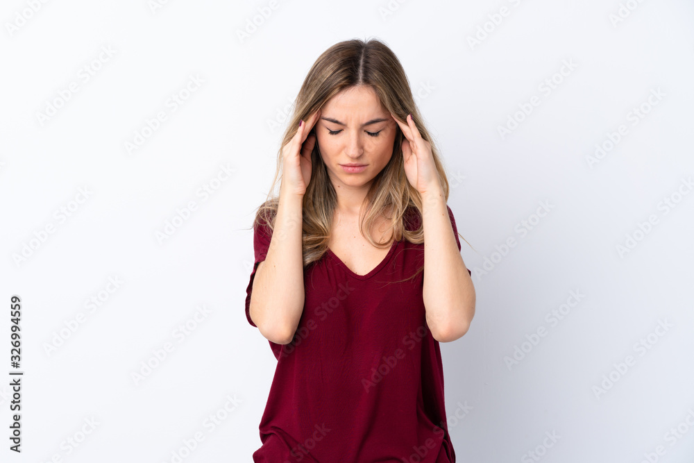 Young woman over isolated white background with headache Young woman over isolated white background with headache