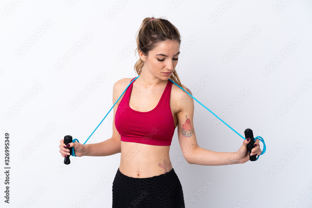 Young sport woman over isolated white background with jumping rope Young sport woman over isolated white background with jumping rope
