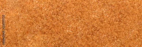 Textured background of fresh homemade golden crepe or thin pancake. Banner. Space for recipe.