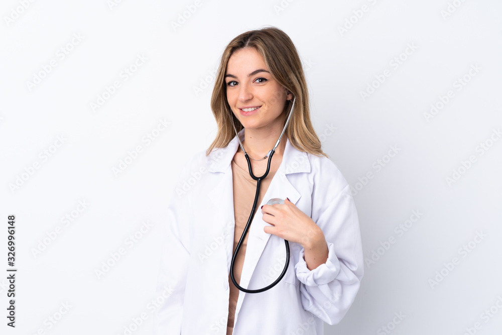 Young woman over isolated white background wearing a doctor gown and with stethoscope Young woman over isolated white background wearing a doctor gown and with stethoscope