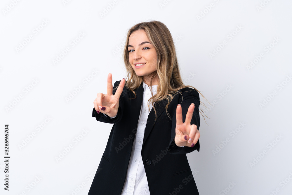 Young business woman over isolated white background smiling and showing victory sign Young business woman over isolated white background smiling and showing victory sign