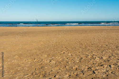 Valencia Beach (Malvarrosa) with blue sky and sand