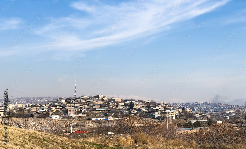 far view of the city, city landscape under the blue sky