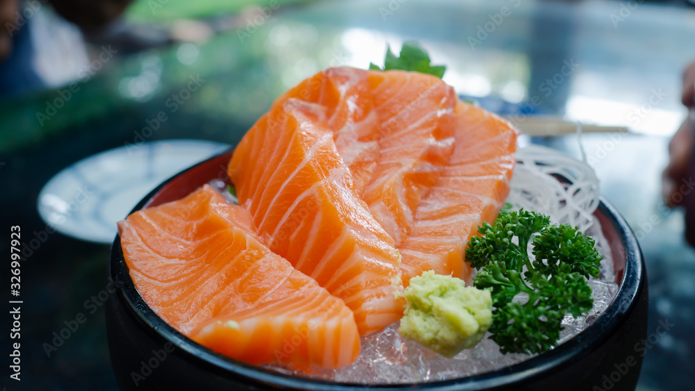 Slide selmon in a desh, selmon sushi japaness food. Slide selmon in a desh, selmon sushi japaness food.