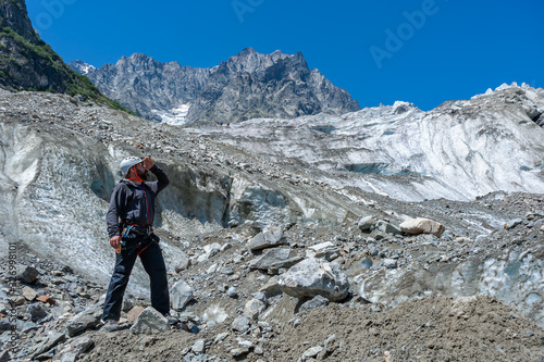 Mountaineer on rock enjoying view