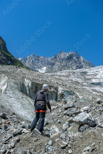 Mountaineer on rock enjoying view
