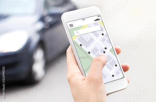 Фотография Car or ride share mobile app in smartphone