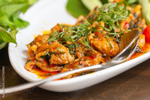 Close up texture of Stir Fried Pork with Chilli Paste. Thai cuisine.