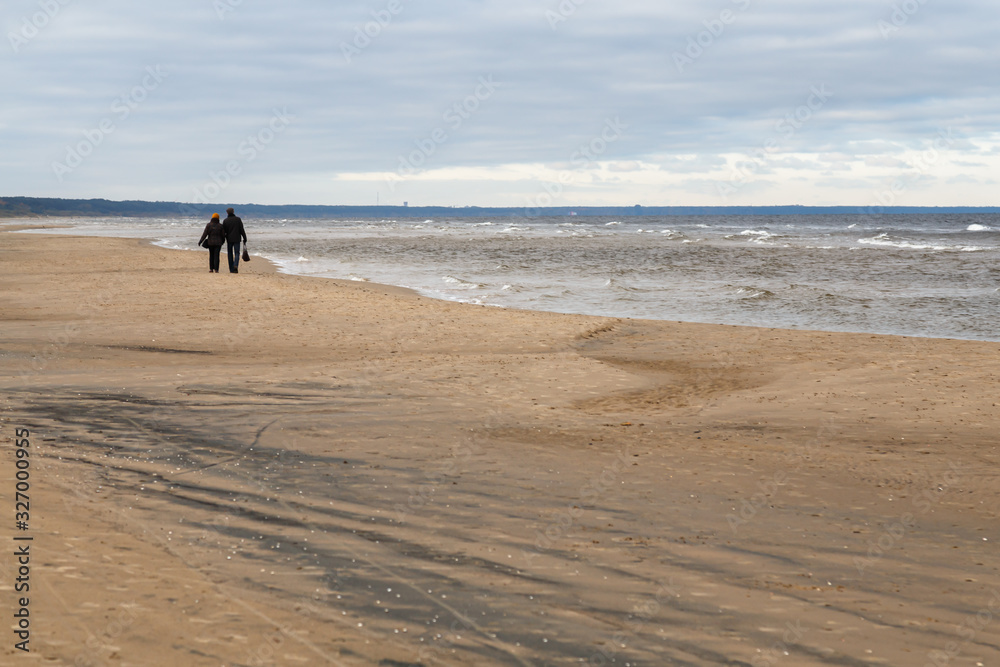 Gulf of Riga, Jurmala region, Latvia. Walking along the empty beach.