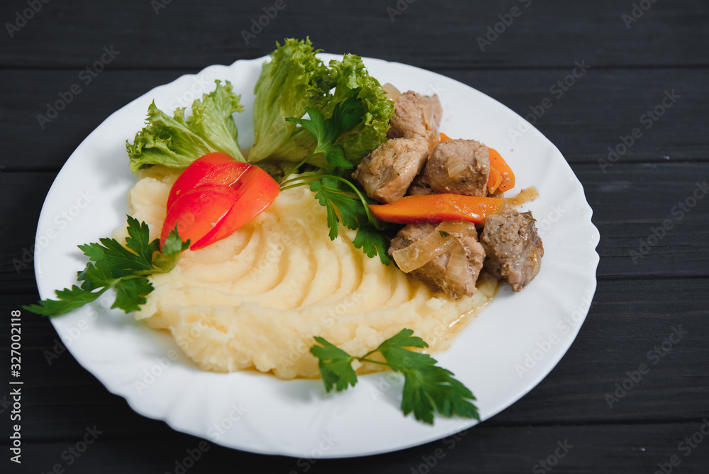 mashed potatoes with meat and vegetables on wooden background mashed potatoes with meat and vegetables on wooden background