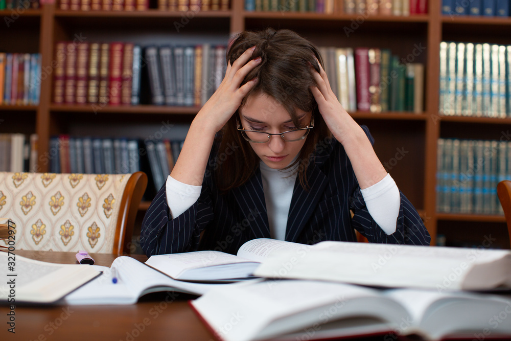 The student is in shock Holds on to the head In library. The student is in shock Holds on to the head In library.