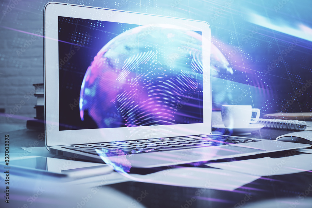 Computer on desktop in office with technology theme hologram. Multi exposure. Tech concept. Computer on desktop in office with technology theme hologram. Multi exposure. Tech concept.