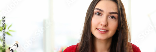 Portrait of young woman in office presenting statistics and analytics report