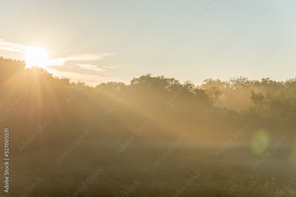 Beautiful sun rays over urban natural park trail near Dallas, Texas, USA