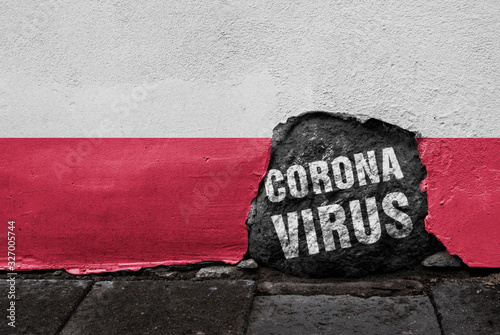 Flag of Poland on the wall with cracked stone with Coronavirus written on it. 2019 - 2020 Novel Coronavirus (2019-nCoV) concept, for an outbreak occurs in the Republic of Poland.
