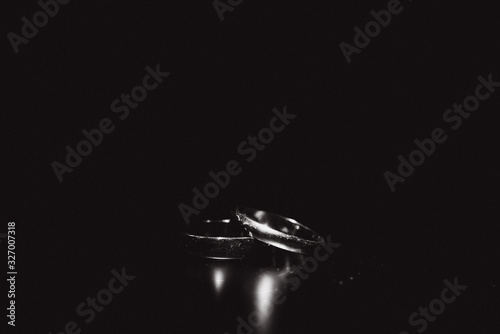 Beautiful wedding gold rings on dark background