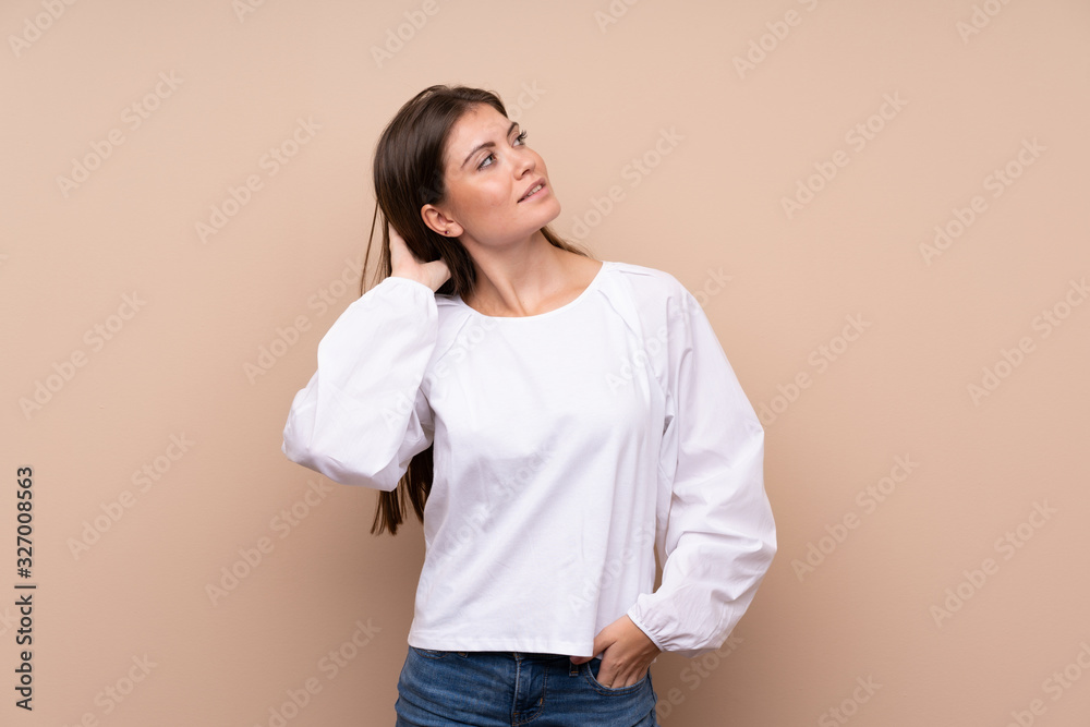 Young girl over isolated background thinking an idea
