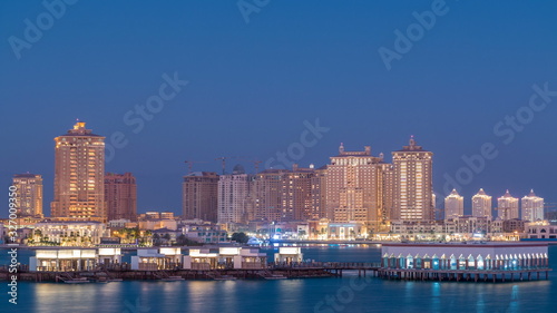 View from Katara Beach day to night timelapse in Doha  Qatar  towards the Pearl