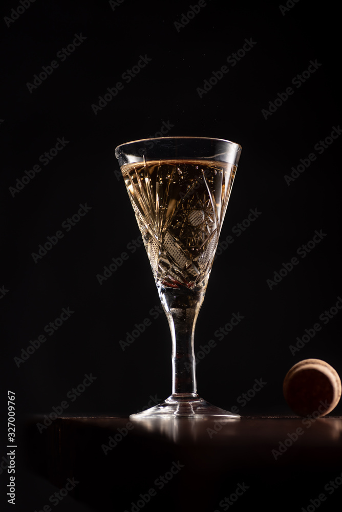 Prosecco wine in glass on rustick wooden tray. Dark Background Prosecco wine in glass on rustick wooden tray. Dark Background