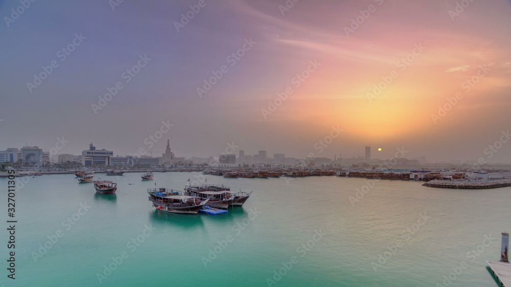 Sunset at Doha Bay timelapse with Traditional Wooden Dhow Fishing Boats.