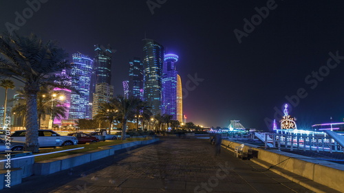 The skyline of Doha by night with starry sky seen from Corniche timelapse , Qatar