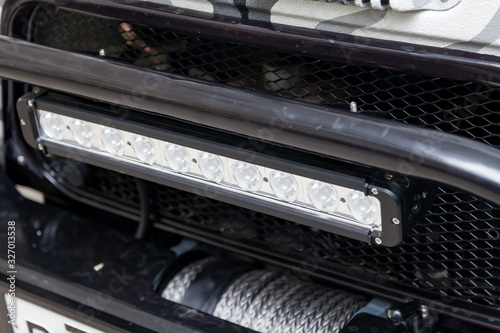 Foto Horizontal LED lamp for lighting in difficult weather conditions on a car prepared for off-road and rally