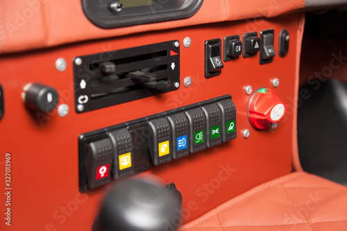 Obraz na plátne Toggle switches and buttons on the car control panel to turn on additional equipment and increase power when driving on off-road, racing and rally