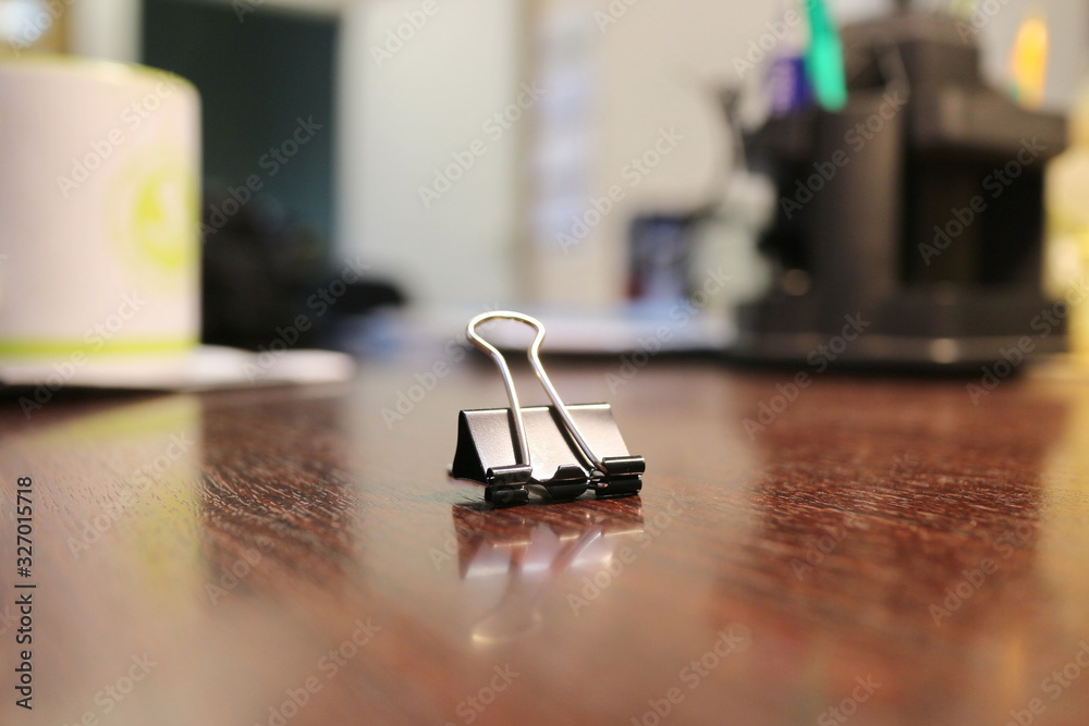 black paper clip on office desk black paper clip on office desk