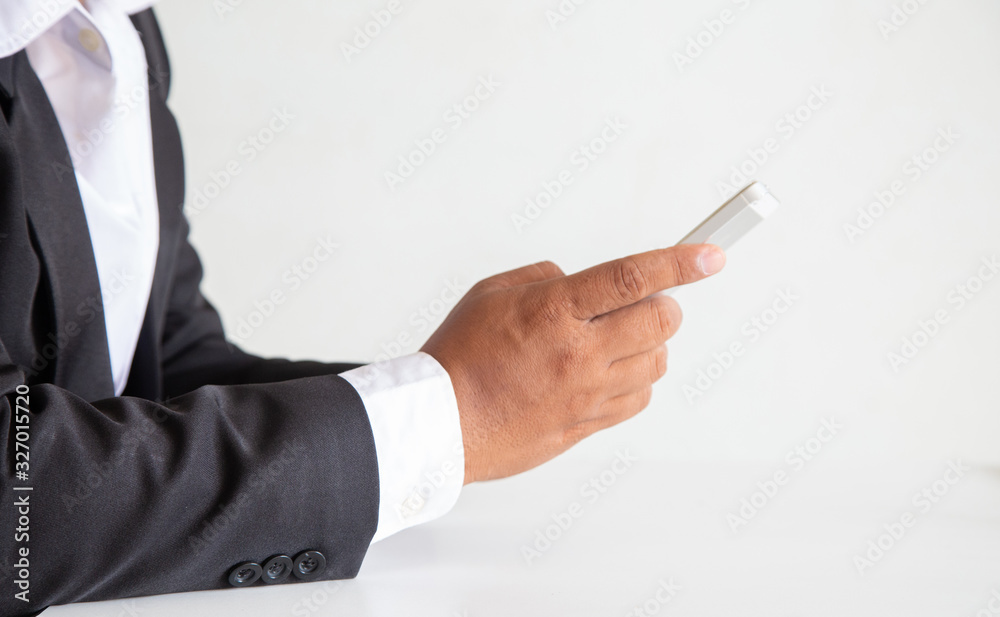 Businessman hand using smartphone in the office,. professional using modern device application for 5g wireless,.technology digital connection online payment and transfer data to software developer Businessman hand using smartphone in the office,. professional using modern device application for 5g wireless,.technology digital connection online payment and transfer data to software developer
