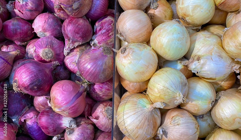 Shallots and onion are sold in cells in supermarkets. Fresh vegetables.