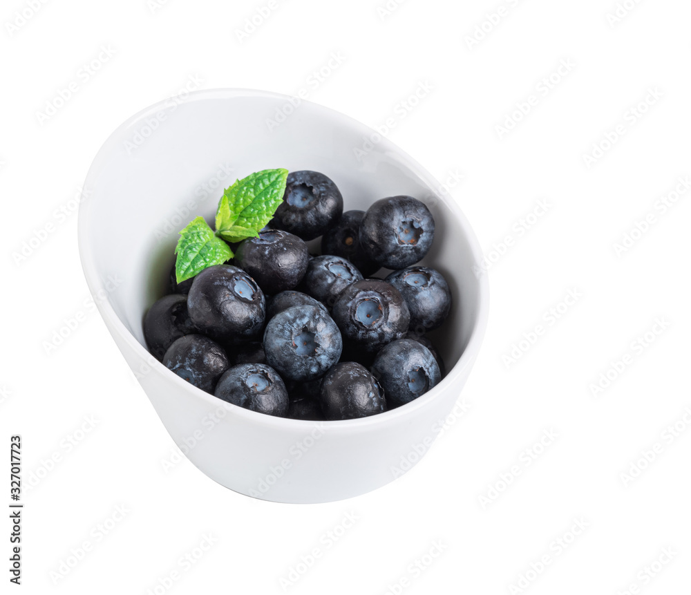 blueberries on a white plate isolated on a white background blueberries on a white plate isolated on a white background