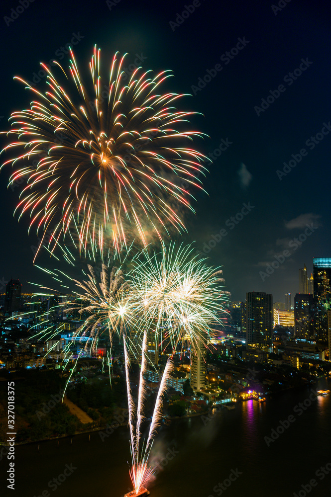 Beautiful firework display for celebration happy new year and merry christmas with Twilight night and firework lighting in bangkok cityscape background, Bangkok, Thailand. Beautiful firework display for celebration happy new year and merry christmas with Twilight night and firework lighting in bangkok cityscape background, Bangkok, Thailand.