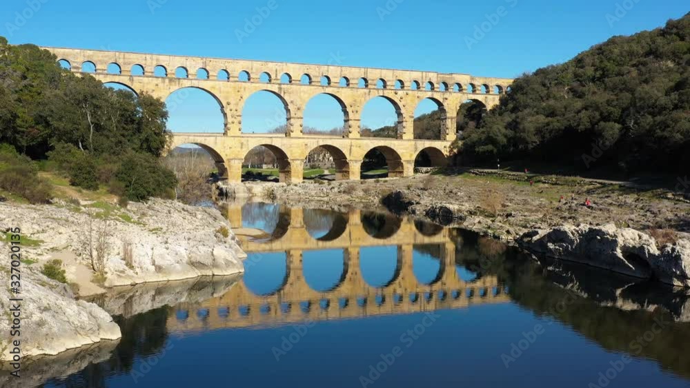 Pont du Gard aerial shot sunny day le Gardon river roman aqueduct old bridge France 