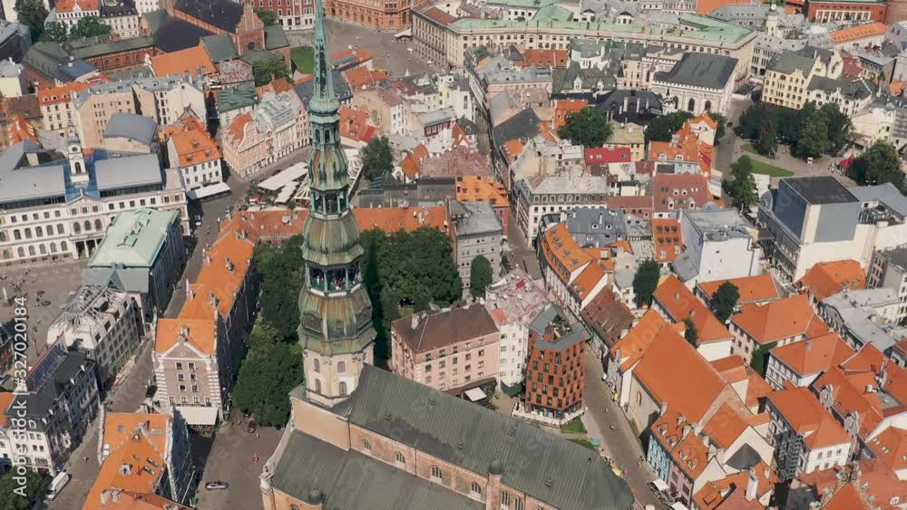 RIGA, LATVIA - MAY, 2019: Aerial panorama view of the old town of Riga by the St. Peters cathedral. RIGA, LATVIA - MAY, 2019: Aerial panorama view of the old town of Riga by the St. Peters cathedral.