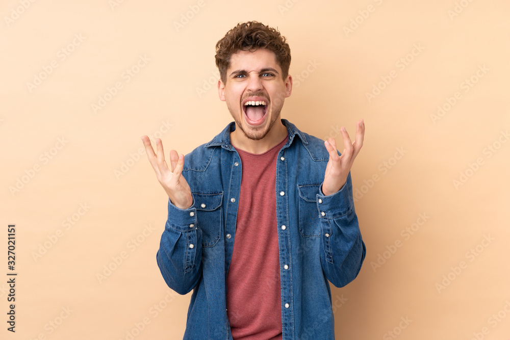 Caucasian man isolated on beige background unhappy and frustrated with something Caucasian man isolated on beige background unhappy and frustrated with something