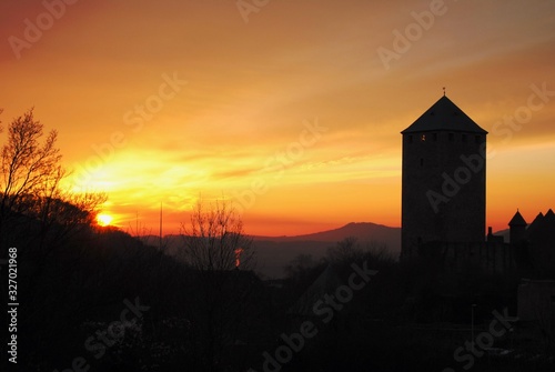 The sun sets behind the Lichtenberg castle in Germany. Burg Lichtenberg is located near Thallichtenberg in the district of Kusel in Rhineland-Palatinate Deutschland. 