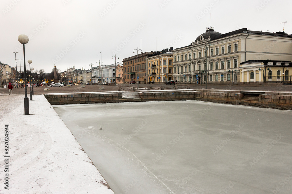 Helsinki, Finland. Views of the frozen waters that surround the old town in a cold winter day, covered in ice and snow