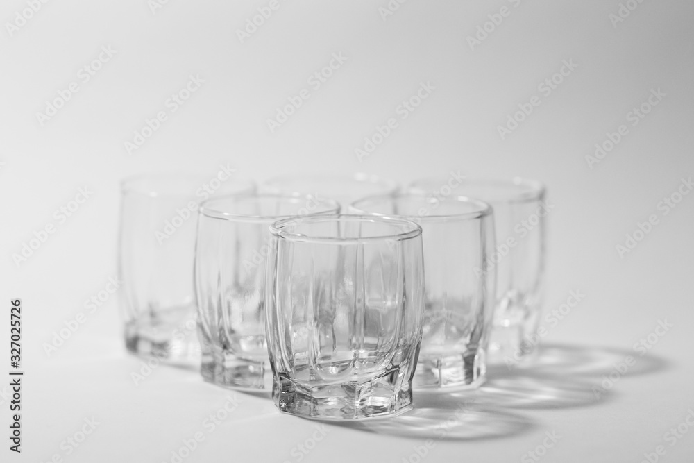 transparent small glasses on a white background transparent small glasses on a white background
