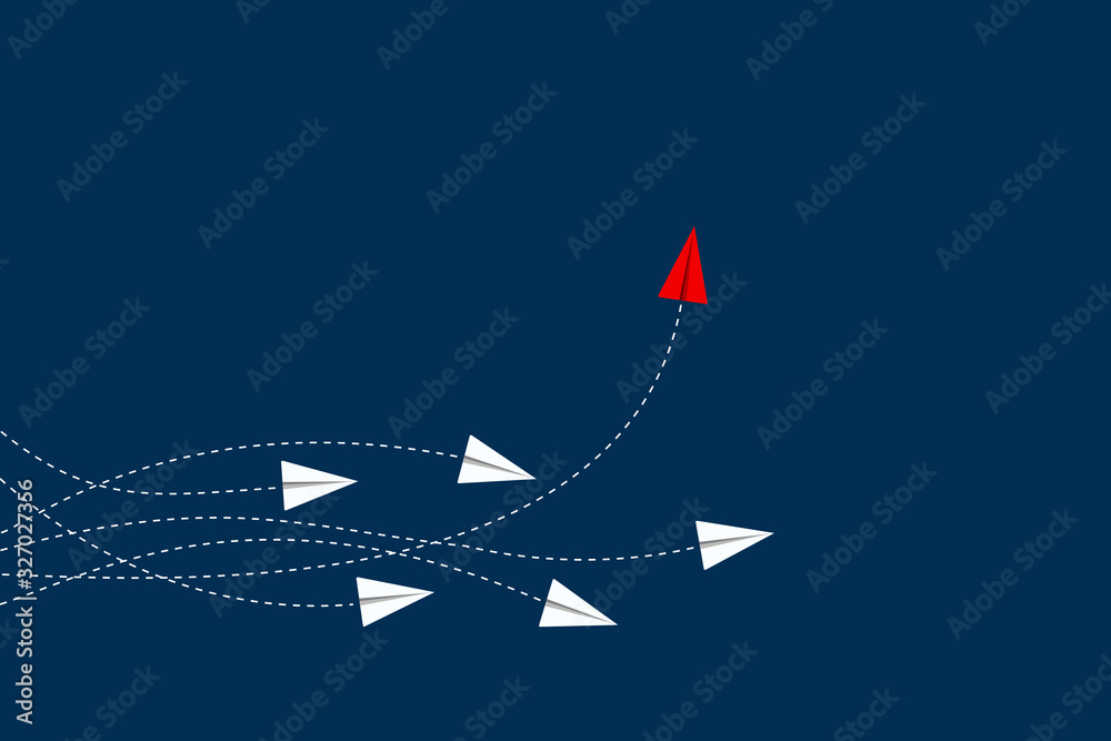 Think differently concept. Red airplane changing direction. New idea ...
