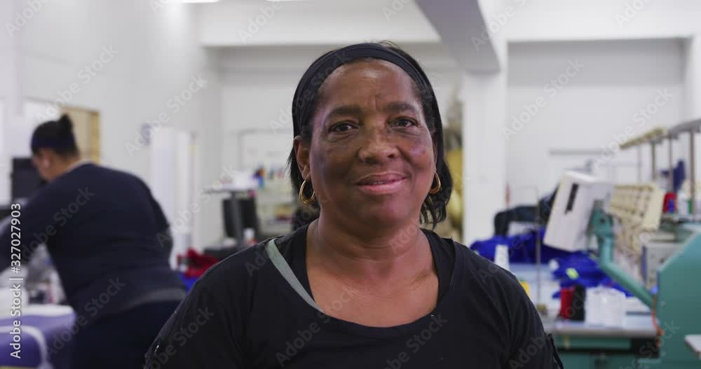 Front view of mixed race woman in factory Front view of mixed race woman in factory