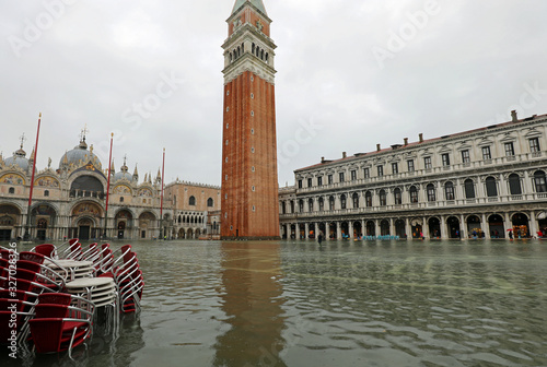 Saint Mark square with bell tower during the Tide in Venice photo